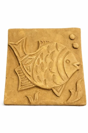 The Terracotta Fish Wall Tile (6″ x 6″) features a raised, carved fish swimming among aquatic plants and two bubbles on a light clay background.