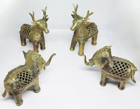 Five brass animal figurines, three representing deer with antlers and two representing elephants with raised trunks, are arranged in a circle on a plain white background.